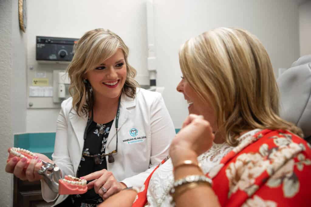 Dentist explaining oral care to a patient