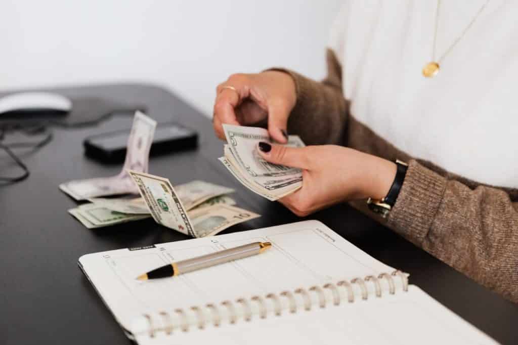 Woman's hands counting money