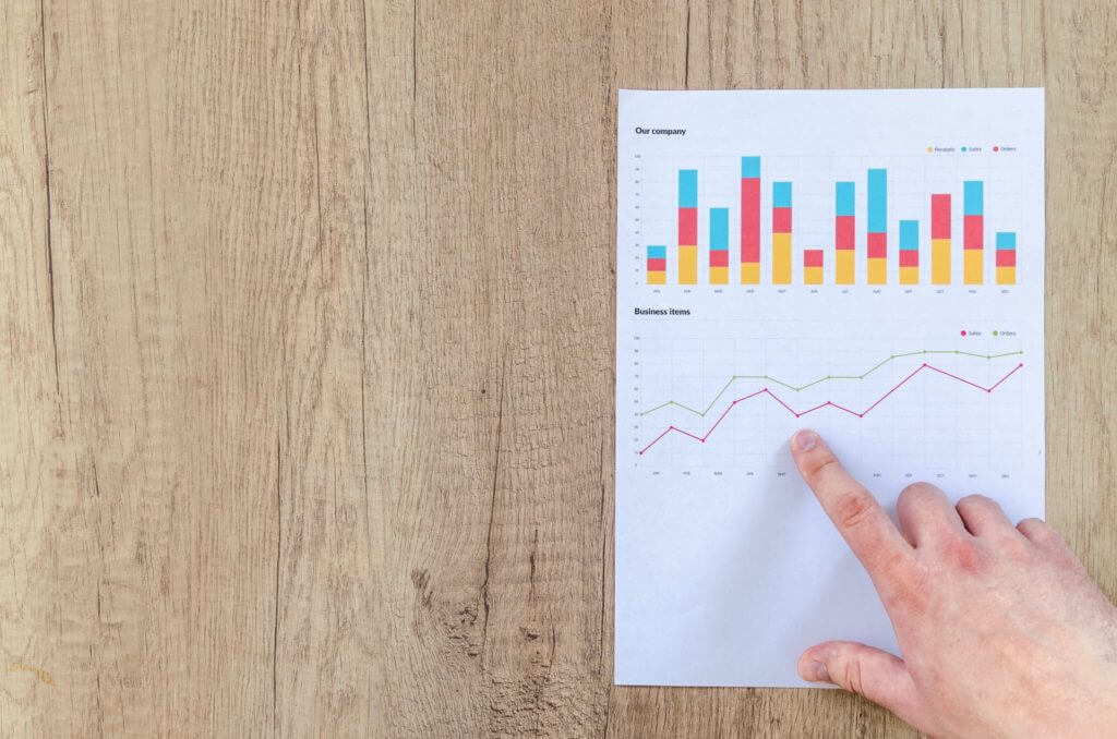 Finger pointing to a chart