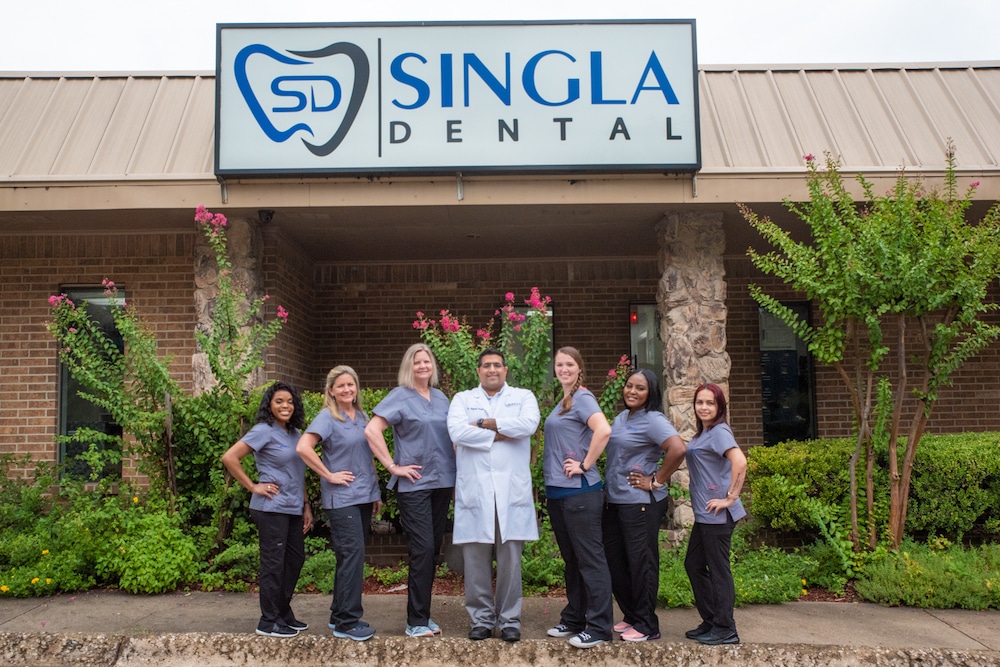 Singla Dental staff photo outside dental practice
