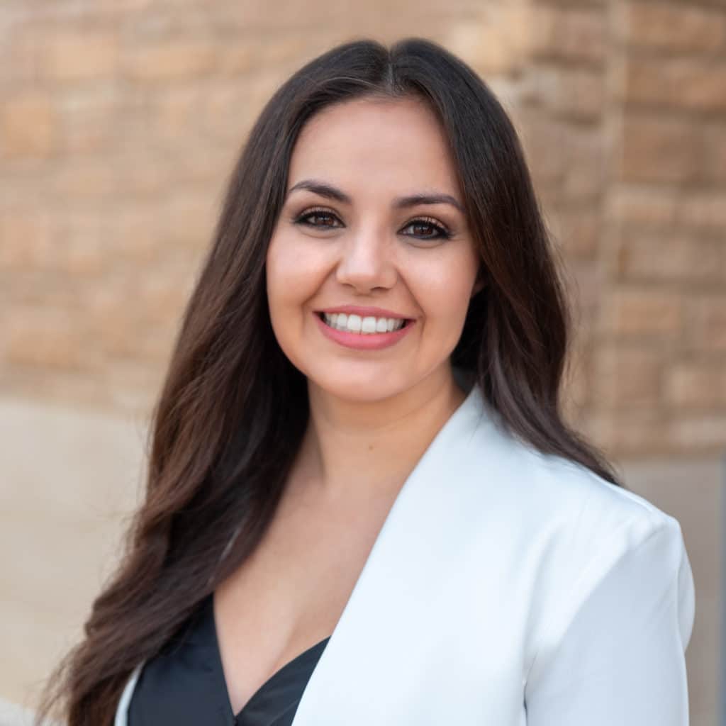 Headshot of dentist in white lab coat