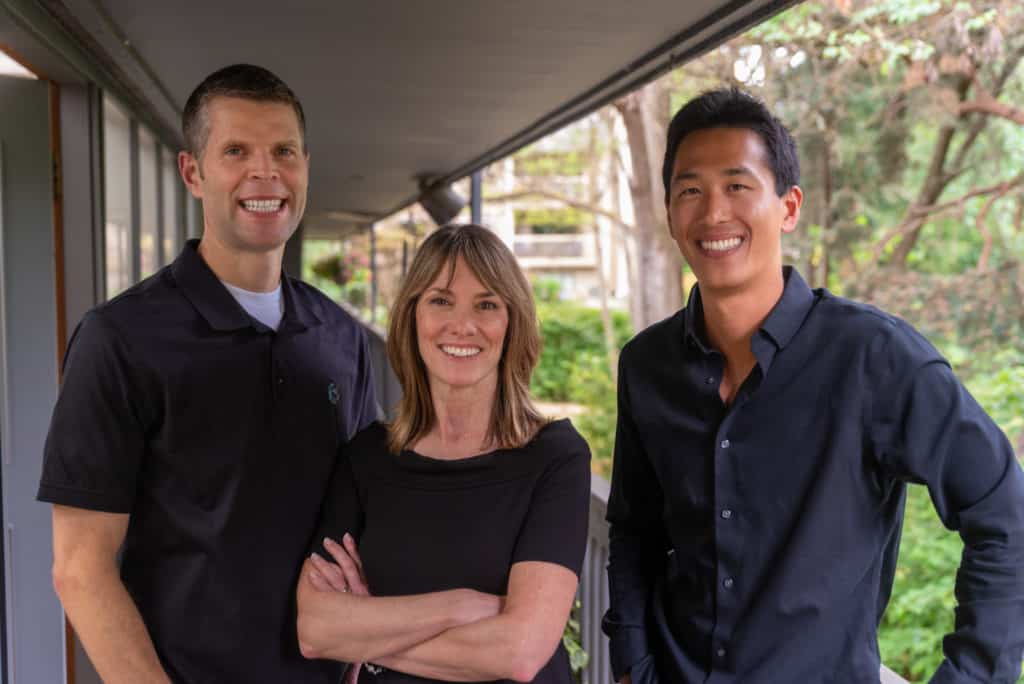 Three dentists in a team photo