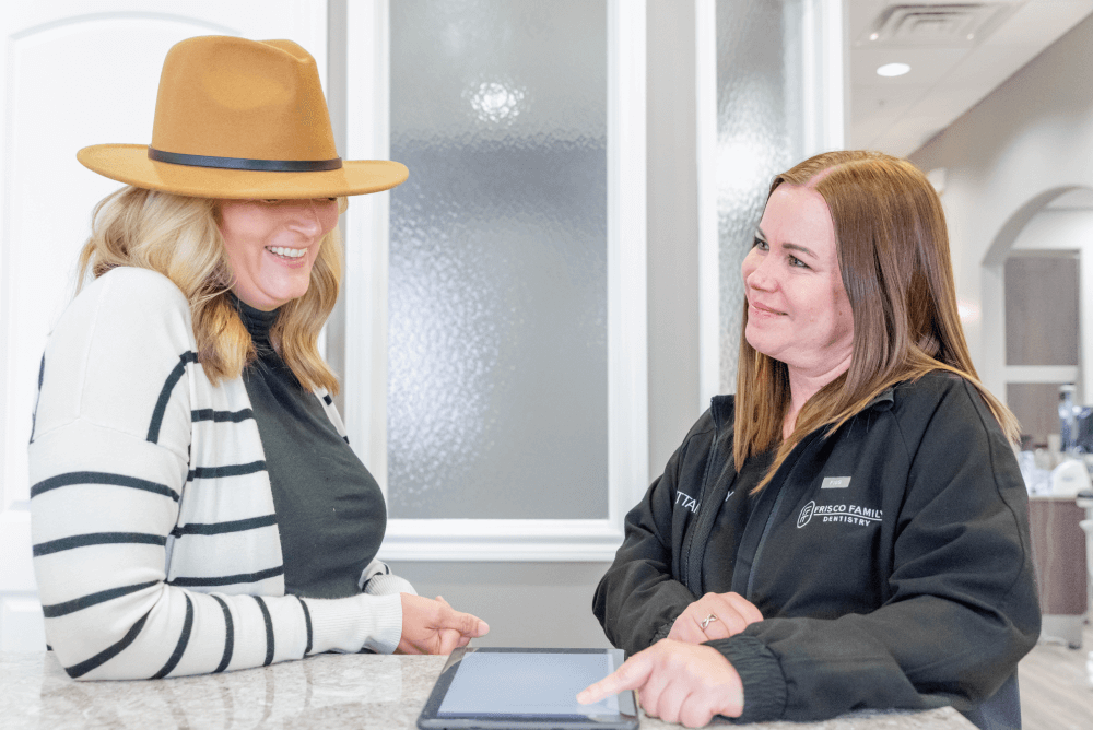 Dental patient and Financial coordinator having a conversation