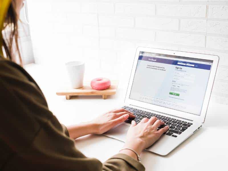 A dental marketing expert logging on to Facebook to manage social media