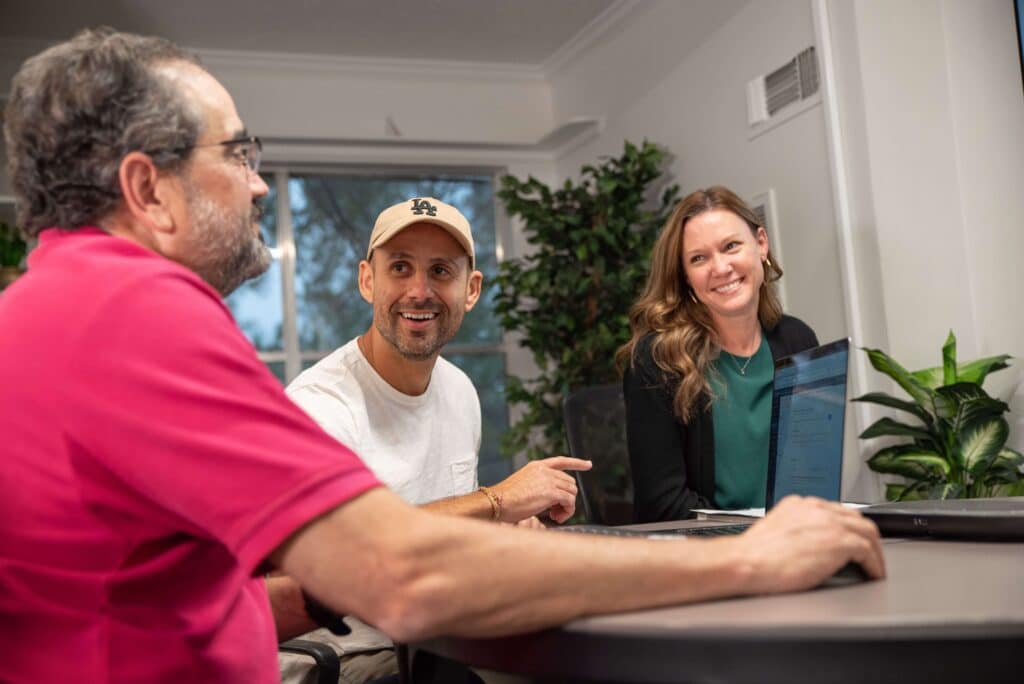 Partner Andre and employee Ted chatting about strategy for our clients are our marketing company for dentists.