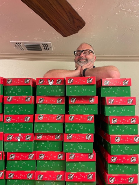 eric with all of the boxes we made for the operation christmas child charity
